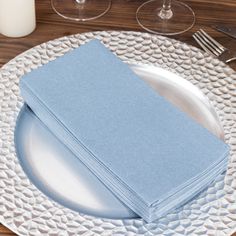 a white plate with blue napkins on it