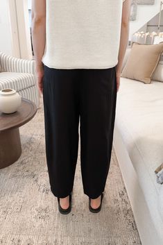 The Laney Tencel Tapered Pants in Black are so lightweight and ready to be paired with your favorite summer blouse. Featuring pleated details, black color, side and back pockets, tapered silhouette, half elastic waistband, zipper closure and a true to size fit. Style these amazing pants with a white tee or knit blouse! Details & Sizing Pleated details Black color Side and back pockets Tapered silhouette Zipper Half elastic waist True to size fit Gabriella is wearing a size S Sizing S Waist:28" I Half Elastic Waistband, Blouse Details, Knit Blouse, Summer Blouse, Summer Blouses, Tapered Pants, Sweater Set, 21 Days, Fit Style