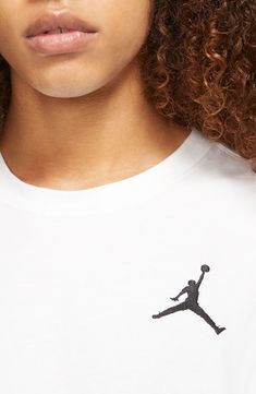 An embroidered Jumpman brings on-court energy to your off-court activities in a T-shirt made for playing or relaxing in the comfort of soft cotton. 29" length (size Medium) Crewneck Short sleeves 100% cotton Machine wash, tumble dry Imported Nike Cotton T-shirt For Baseball Season, White Basketball T-shirt For Sports Season, White Short Sleeve Basketball T-shirt, Basketball Short Sleeve T-shirt With Screen Print, Graphic Cotton Basketball T-shirt, Embroidered Tshirt, White And Black, Short Sleeves, Nordstrom