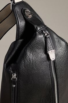 Exclusively at Anthropologie Polyurethane; polyester lining Two outer zip pockets Two inner zip pockets Zipper styling Imported | x Anthropologie Front-Zip Sling Bag by Urban Originals in Black, Women's, Polyester/Polyurethane Versatile Pouch Shoulder Bag With Zipper, Versatile Pouch Shoulder Bag With Zipper Closure, Black Leather Shoulder Bag With Metal Zipper, Functional Crossbody Hobo Bag With Zipper Pocket, Business Zipper Closure Crossbody Shoulder Bag, Business Crossbody Shoulder Bag With Zipper Closure, Casual Business Shoulder Bag With Zipper Closure, Business Shoulder Hobo Bag With Zipper Closure, Luxury Leather Shoulder Bag With Metal Zipper