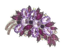 a purple flower brooch with lots of crystals on it's center and sides