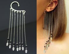 This long chain feather ear cuff with beads and charms I designed for extraordinary person who loves statement jewelry! No piercing needed to wear this ear cuff model. It slips behind your ear and rest against your head with the dangles showing below the ear seven pieces of chain with the feather charms. It's very comfortable and easy to wear. The length of chain with charm is 13 cm (5 in). The price is for 1 ear cuff. More unusual ear cuffs from SomeBijoux4You: https://www.etsy.com/shop/SomeBij Party Dangle Ear Cuff With Adjustable Chain, Bohemian Dangle Ear Cuff For Party, Bohemian Party Dangle Ear Cuff, Pinup Jewelry, Spike Ear Cuff, Rockabilly Earrings, Silver Ear Cuff Earrings, Feather Ear Cuff, Non Pierced Earrings