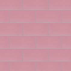 a pink brick wall that is very close to the ground