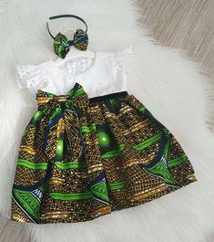 Make your little girl the star of the occasion with this elegant African wax dress and headband set. Crafted from 100% cotton wax fabric, the dress boasts vibrant colors and eye-catching prints, perfect for any special event. Available in sizes for 1 and 4-year-olds, this dress is designed for comfort and style. The coordinating headband adds the perfect finishing touch to complete the look. Elevate your child's wardrobe with this stunning dress and headband set that captures the beauty of Afric Kids Gown Design, Wax Dress, Mother Daughter Fashion, Girls Dresses Diy, African Wear Dresses, Headband Wedding, Fashion Sewing Tutorials, Kids Gown