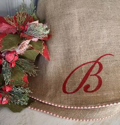 a burlocked christmas wreath with the letter b on it