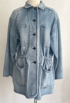 Distressed vintage 80's/90's Lands End light wash denim parka jacket Waist can be cinched in with adjustable interior toggle belt 100% cotton Made in El Salvador Marked size M (10-12) and seems to fit a modern S/M depending on how you want it to drape.  Photographed on a size 2/4 dress form. Please use measurements to ensure a proper fit. Measurements (laying flat): Shoulder seam-to-shoulder seam: 21" Pit-to-pit: 23" Top of shoulder-to-hem: 31-1/2" Pit-to-cuff: 17" Good vintage condition with distressed patina and fraying at the seams and cuffs. A NOTE ABOUT MY CLOTHING LISTINGS: I'm very picky when it comes to cut and style so you can rest assured my vintage garments will be WEARABLE mixed in with your modern wardrobe.  I only source high-quality pieces in good to excellent condition and 70s Denim Puffy Coat, Vintage Outerwear With Frayed Hem And Long Sleeves, Vintage Long Sleeve Outerwear With Frayed Hem, Spring Outerwear With Faded Color And Frayed Hem, Spring Outerwear With Frayed Hem In Faded Color, Vintage Outerwear With Frayed Hem For Fall, 90s Style Relaxed Fit Spring Outerwear, 90s Spring Outerwear With Relaxed Fit, Spring Washed Blue Utility Jacket With Pockets