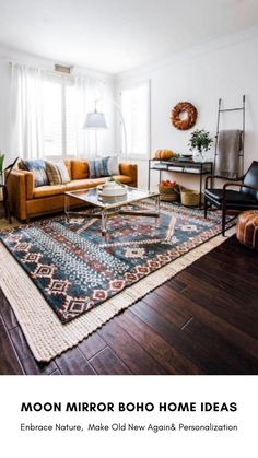 a living room filled with furniture and a rug on top of a hard wood floor