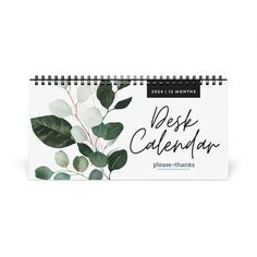 a desk calendar with leaves on it