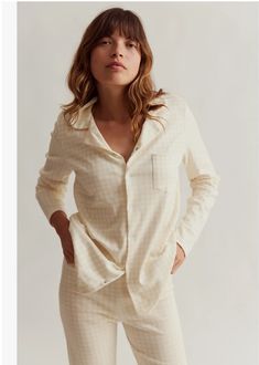 The softest women's shirt and wide leg pj set featuring Sleepy Doe's gingham print in buttermilk. This set has a blouse with popper opening and a comfortable baggy trouser with elastic waist. 100% organic cotton, a very soft interlock fabric for maximum night-time comfort. Details • Made in United Kingdom • Fabric: 100 % Organic Cotton • Weight: 1.2 lb (0.5 kg) Model wears a size medium. Sleepy doe's trouser is designed to sit on your ankle once washed to avoid tripping. Wash at 30 degrees, but Free Yarn, Classic Pajamas, Yarn For Sale, Lace Weight Yarn, Baggy Trousers, Cotton Sleepwear, Sport Weight Yarn, Women Nightwear, Gingham Print