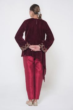 Maroon full sleeves cross cut tunic crafted in velvet with kashmiri bloom golden tilla embroidery detail. Paired with a straight silk pant. - Aza Fashions Party Kurta With Embroidered Long Sleeves, Traditional Long Sleeve Blouse With Dabka, Traditional Long Sleeve Dabka Blouse, Festive Bandhgala With Embroidered Long Sleeves, Long Sleeve Velvet Kurta With Zari Work, Long Sleeve Blouse With Dabka Work For Festive Occasions, Festive Long Sleeve Blouse For Eid, Velvet Bandhgala For Eid Festivities, Festive Velvet Long Sleeve Sherwani