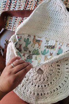 A woman holding a fringed crochet boho bag pattern. Boho Crochet Free Patterns, Crochet Cross Body Bag Pattern Free, Crochet Makeup Bag Pattern Free, Crochet Boho Bag Pattern Free, Crochet Bag Pattern Free Easy Handbags, Crochet Purses And Bags Patterns Free, Diy Purse Tassel, Boho Bag Pattern Free