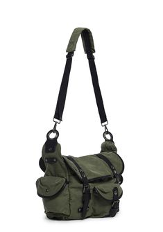 This crossbody bag has a washed twill construction, side cargo pockets with snap button closures, a front pocket with a buckle closure, a removable and adjustable nylon shoulder strap, and a top zipper closure with an additional flap and buckle closure. Multi Pocket Bag, Cargo Pocket, Cute Bags, Green Bag, Dolls Kill, Gothic Fashion, Body Bag, Snap Button, Online Boutique