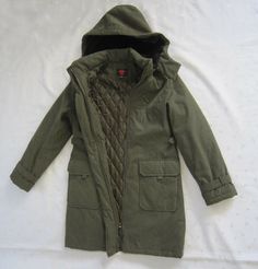 GALLERY  Women's Brown Fur Hood Padded Lining Anorak Parka Coat Size: S / Small Color: Olive Green Material: Shell - 88% Polyester, 12% Nylon Fur - 82% Acrylic, 18% Polyester Lining - 100% Nylon Filling - 100% Polyester Measurements: 19" Across Chest 20.5" Across hips 34" Length from Shoulder to Bottom 18.25" Sleeve Length from armpit to end Details: Removable Hood with Soft Faux Fur Hood Lining Front snap and hidden zip closure Long sleeves with magnetic tab strap closure Velcro closure flap po Casual Khaki Parka With Fleece Lining, Cotton Parka With Adjustable Hood For Cold Weather, Cotton Parka With Drawstring Hood For Cold Weather, Casual Khaki Parka With Detachable Hood, Casual Cotton Parka For Cold Weather, Khaki Parka With Drawstring Hood For Cold Weather, Cotton Parka With Detachable Hood For Outdoor, Casual Cotton Parka With Detachable Hood, Khaki Cotton Parka For Cold Weather