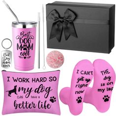 a pink gift box with matching items and a dog's paw print