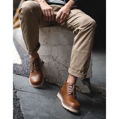 Step up your style game with our Mid-Cut Tooling Leather British Style Men's Desert Boot. These boots are perfect for the fashion-forward young crowd who want to make a statement while staying comfortable. With their casual yet trendy design. they're a must-have for the fall and winter seasons.Crafted from high-quality two-layered cowhide leather. these boots showcase the unique and rugged charm of crazy horse leather. The brown color adds a touch of sophistication. making them versatile enough to pair with any outfit. The front lace closure ensures a secure fit while adding a stylish element to the overall look.Designed with your comfort in mind. these boots feature a round head-toe style that provides ample space for your toes to move freely. The flat heel and rubber sole offer stability Casual Leather Martin Boots With Leather Sole, Urban Ankle-high Boots For Fall Season, Casual Combat Boots For Workwear In Fall, Casual Combat Boots For Workwear And Fall, Brown Lace-up Boots For Fall Streetwear, Masculine Leather Sole Work Boots For Fall, Fall Martin Boots With Rubber Sole For Streetwear, Masculine Leather-sole Work Boots For Fall, Fall Streetwear Martin Boots With Rubber Sole