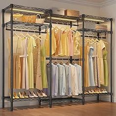 an organized closet with clothes and shoes