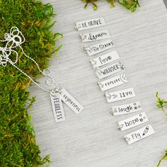 "Great daily inspiration, this necklace features up to 3 charms. Each charm is hand crafted and stamped with your choice of inspirational word or phrase. And it's perfect for layering! The Details *Handcrafted using sterling silver *The charms measure 3/4\" x 1/4\" *Please specify your preferred charm(s) in the \"notes to seller\" box at checkout. The Process Hand stamping is a very different process than traditional engraving. Hand stamping is done entirely by hand, with a hammer and steel stam Meaningful Hand Stamped Sterling Silver Charm Necklace, Meaningful Hand Stamped Sterling Silver Charm Necklaces, Silver Hand Stamped Meaningful Charm Necklace, Inspirational Hand Stamped Necklace For Best Friend, Inspirational Personalized Charm Necklace For Best Friend, Everyday Meaningful Engraved Charm Necklaces, Personalized Inspirational Charm Necklace For Best Friend, Inspirational Sterling Silver Nickel-free Charm Necklace, Everyday Engraved Meaningful Charm Necklaces