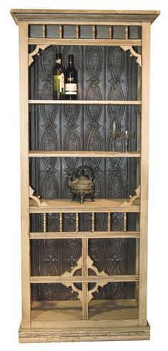 this is an image of a bookcase made out of wood and iron grills