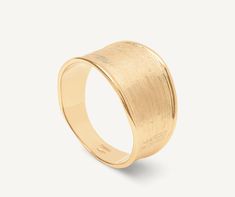 The 18K yellow gold small band ring, with its irregular surface and linear design, has been finely hand-engraved using an ancient Florentine technique, granting it extraordinary lustre and a silky surface. A unique fit for an elegant and timeless piece of jewellery. Elegant Hammered Wide Band Ring, Elegant 14k Gold Hammered Wide Band Ring, Elegant Hammered Yellow Gold Engraved Ring, Elegant Hammered Gold Engraved Ring, Elegant Gold Hammered Engraved Ring, Elegant Yellow Gold Hammered Engraved Ring, Small Band, Ancient Tools, Linear Design