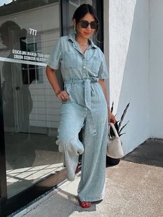 Cuties like you can appreciate a one-and-done look that always impresses, like the Franki Denim Chambray Short Sleeve Jumpsuit! Lightweight, 100% cotton chambray shapes this too-chic jumpsuit that features a collared neckline, short sleeves. A button detail at the front continues past the relaxed waist, that boasts a matching belt sash, all atop wide, full-length pant legs with side pockets and back patch pockets. Acid Wash Light Denim Chambray Soft Fabric Relaxed Wide Leg Shell: 100% Cotton Han Casual Collared Denim Jumpsuit With Button Closure, Chic Denim Blue Jumpsuits And Rompers With Pockets, Trendy Collared Cotton Jumpsuits And Rompers, Casual Collared Denim Jumpsuit With Pockets, Spring Collared Denim Jumpsuits And Rompers, Casual Collared Jumpsuits And Rompers With Relaxed Fit, Trendy Cotton Collared Jumpsuits And Rompers, Casual Collared Cotton Jumpsuits And Rompers, Casual Cotton Collared Jumpsuits And Rompers