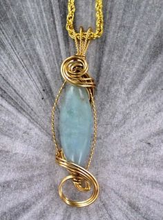 THE BEAUTY OF AQUAMARINE Amazing!!! 40mm  AQUAMARINE    gemstone----- set in handcrafted  14k. rolled gold setting gemstone with high detail which cannot be seen in the photograph. The pendant -- Intricate detail that you can see and noticeMEASURES 3  INCHES TALLVery delicate and intricate in appearance and will get you noticed! handcrafted piece of jewelry that anyone will look good inThe pendant  is absolutely amazing something that you will be proud to wearAAA Quality Gemstone18 INCH GOLD PLA Gold Aquamarine Round Jewelry, Round Aquamarine Gold Jewelry, Yellow Gold Aquamarine Pendant Jewelry, Handmade Aquamarine Jewelry For Anniversary, Handmade Aquamarine Jewelry Gift, Handmade Aquamarine Pendant Jewelry, Gold Aquamarine Pendant Necklace, Unique Aquamarine Jewelry As A Gift, Unique Aquamarine Jewelry For Gift