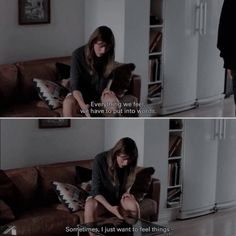 a woman sitting on top of a brown couch next to a book shelf