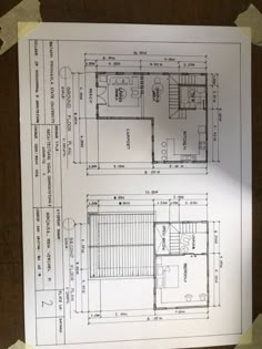 the floor plan for a two story house is on top of a piece of paper