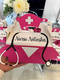 a nurse hat with stethoscope on it and name tags attached to it