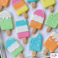 some colorful ice cream and popsicle cookies on a tray