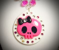 "Large Pink Punk Skull with White Frame Necklace with multicolour rhinestones.The frames are really large approx 2x2\" and the skull is approx 1.5\" wide. Choose from: Pink Punk Skull on White frame with White and pink beads Each necklace is about 16-18\" adjustable, but if you want a different length, please let me know in the comments. Subscribe here to keep updated with new products and promotions http://eepurl.com/bpd7Dr Follow me on Twitter /Instagram @MMJewelleryBox or  Facebook: https://w Pink Skull Jewelry For Halloween, Pink Alt, Pink Emo, Necklaces Pink, Frame Necklace, Pink Punk, Punk Skull, Pearl Jewelry Wedding, Beach Necklaces