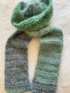 Crochet scarf made with Carron Latte Cakes yarn. 58% acrylic and 42% nylon Velvet teal yarn. Super soft and light weight. Machine washable and dryable. Wash in delicate setting. Do not bleach. Tumble dry at low heat, delicate setting. Green Yarn Scarves For Winter, Green Acrylic Yarn Scarves For Winter, Winter Green Yarn Scarves, Green Acrylic Yarn Scarf For Winter, Green Knitted Scarf One Size, Green Knitted One-size Scarves, Green Knitted Scarf, Crochet Scarf, Scarf Wrap