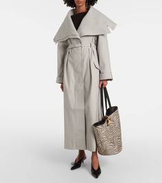 Find JACQUEMUS Le Trench Caruso Oversized Trench Coat on Editorialist. Material: 35% polyester, 34% cotton, 29% wool, 2% elastane. Care instructions: dry clean. Made in Portugal. Designer color name: Light Grey. Quarter-lined. Lining: 48% cotton, 47% acetate, 5% elastane. Closure: concealed buttoned front. Pockets: flap pockets. Sleeves: long-sleeved. Length: full length. Detachable belt. Belt loops. Luxury Cotton Outerwear For Spring, Elegant Oversized Cotton Outerwear, Chic Oversized Gabardine Outerwear, Oversized Luxury Spring Outerwear, Luxury Oversized Outerwear For Spring, Luxury Cotton Outerwear For Winter, Luxury Oversized Outerwear For Fall, Luxury Oversized Fall Outerwear, Oversized Trench