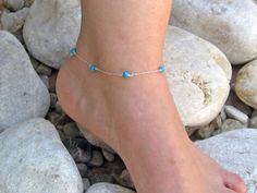 "A delicate ankle bracelet made with seven turquoise howlite round stone beads connected with a dainty thin 14k gold fill or 925 sterling silver chain! Simple and elegante! - 14k Gold Filled(not plated) or 925 Sterling Silver chain, wire and components - Turquoise Howlite 4mm - Turquoise shade may vary slightly due to the natural quality of the stone - Ankle's length in photos is approx. 9\" = 22.5cm - Comes in a cute little organza bag! - If you prefer a gift box, ready for gift giving, please Turquoise Ankle Bracelet, Gemstone Anklet, Turquoise Anklet, Closet Collection, Beach Anklets, Turquoise Howlite, Foot Jewelry, Ankle Bracelet, 925 Sterling Silver Chain