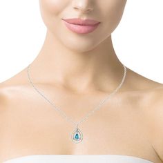 This exquisite necklace features a beautiful Swiss blue topaz set in 18k white gold with sparkling diamonds! The 1.33 carat blue topaz is a lovely elongated pear shape with gorgeous, vivid blue color. Double floating halos, each hand-set with petite diamonds, add endless sparkle to this elegant design. Larger diamonds accent the halos and create lines that echo the slender, diamond studded bail. This necklace can be worn during the day and will transition beautifully into the evening for dressy events! Pendant measures approximately 1-5/8 length, 3/4" width. A 14k white gold chain measuring 16 inches is included. Blue topaz, 10.00 x 5.50mm, 1.33 carats119 round brilliant-cut diamonds, .79 carats total Luxury Teardrop Blue Topaz Necklace, Blue Topaz Necklace Jtv, Unstoppable Love Aqua Marine Snowflake Necklace Zales, Ring Pendant Necklace, Swiss Blue Topaz, Sparkle Diamonds, Shades Of Purple, Round Brilliant Cut Diamond, Pear Shape