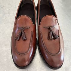 Brand New, Never Worn.Leather Soles. Leather Tassel Loafers With Branded Insole, Leather Tassel Loafers With Goodyear Welt For Business Casual, Leather Moccasins With Brogue Detailing, Masculine Leather Moccasins With Brogue Detailing, Leather Loafers For Galas, Leather Tassel Loafers For Business, Masculine Leather Tassel Loafers For Business, Masculine Tassel Loafers With Leather Sole, Masculine Tassel Loafers With Round Toe For Formal Occasions