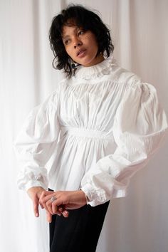 Spectacular and rare late regency period blouse, circa 1820s (or maybe older I'm not entirely sure). This stunning piece features graduated mutton sleeves with a fabulous cut, tiny hand embroidered floral details in white color, a double frilled collar, empire pleated waist and inner waist ties to close it. Definitely a collection or museum worthy piece! NB: I'm not sure if the open side what meant to be worn on the front, anyway both way to do are stunning! -Label: None -Size : please refer to Victorian Ruffle Collar, Mutton Sleeve, Pleated Bodice, Ruffled Collar, Edwardian Fashion, Style Change, Cotton Blouse, Style Expert, Cotton Blouses