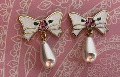 "Beautiful vintage enamel earrings in the shape of butterflies. These are gold plated, pierced earrings with an enameled top, a hand painted rose and a pretty pearl teardrop. We have many of these earrings in stock. They are in excellent, unused condition. They were made the old fashioned way with hard enamel. (2) 1 Pair Size: 3/4\" long Quantity: 1 pair. 🌺 Click here to return to my shop: https://www.etsy.com/shop/VintageRoseFindings 🌸 favorite our shop for updates 🌿Instagram@vintagerosefind Gold Enamel Clip-on Earrings For Gift, Vintage Teardrop Clip-on Earrings As Gift, White Enamel Clip-on Jewelry, Elegant Enamel Drop Clip-on Earrings, Enamel Clip-on Earrings As Gift, Elegant Pink Enamel Earrings, Vintage Teardrop Clip-on Earrings For Gift, Vintage Pearl Earrings Gift, Vintage Pearl Earrings For Gifts