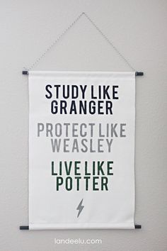 a banner hanging on the wall that says, study like granny protect like weasely live like potter