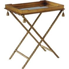 a wooden tray with metal legs and roped ends on an iron stand holding a glass top