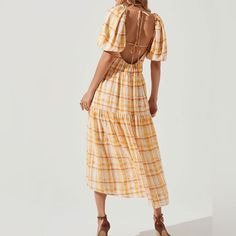 New In Medium (Would Fit Large) There’s Just Something About Summertime And Plaid. This Dress From Astr Has A Square Neckline, Puff Sleeves, And A Tiered Design. The Details- Short Puff Sleeves Open Back Features Tying Straps Fully Lined Side Pocket Accents Yellow Tie-back Dress For Vacation, Yellow Midi-length Dress With Smocked Back, Yellow Midi Dress With Smocked Back, Spring Yellow Midi Dress With Smocked Back, Yellow Summer Dresses With Smocked Back, Yellow Midi Dress With Smocked Back For Beach, Yellow Summer Dress With Smocked Back, Casual Yellow Midi Dress With Smocked Back, Yellow Midi Dress For Beach With Smocked Back