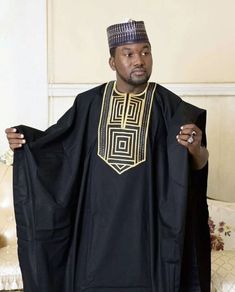 Step into a world of luxury and sophistication with our premium quality 100% cotton Agbada for men. Impeccably designed and tailored, this traditional suit comes in black and gold, adorned with intricate embroidery that showcases the beauty of Yoruba culture. Originating from Nigeria, West Africa, Agbada has long been associated with prestige and affluence among the Yoruba people. However, in today's fashion world, it has gained widespread popularity and has become a go-to attire for formal events, such as weddings, engagements, church services, African heritage parties, black history month celebrations, and other special occasions. Whether you're attending a traditional marriage or a black-tie event, our Agbada will make a bold statement and set you apart from the crowd. With its elegant Agbada Outfit, African Men Clothing, Suit Prom, Matching Pants Set, Costume Africain, Traditional Suit, Wedding Suits Groom, African Clothing For Men, Groomsmen Suits