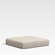 an image of a square cushion on the floor