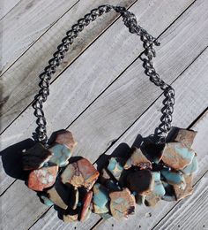 Light blue and brown African opal aqua terra jasper / varcasite stone cluster necklace with czech glass accents on a silver heavy chain. My jewelry is unique and handmade, so no two pieces will ever be exactly the same. Real colors may slightly differ from their appearance on your display, as it depends on your monitor settings and how your screen colors are calibrated. Turquoise Jasper For Jewelry Making, Turquoise Jasper Jewelry For Jewelry Making, Turquoise Jasper Jewelry With Natural Stones, Unique Turquoise Jasper Jewelry, Aqua Terra, Heavy Chain, Cluster Necklace, Bib Necklaces, Blue And Brown