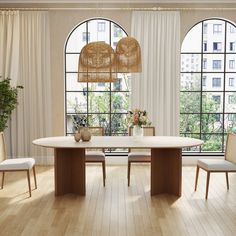 a dining room table and chairs in front of large windows