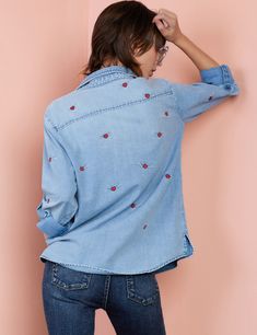 Bring the love, with the Denim Love Wing Shirt from Billy T. Beyond-cute winged-heart embroidery detail, on our classic, buttery-soft oversize denim shirt. The model is 5'7" wearing size Small Trendy Cotton V-neck Denim Top, Casual Cotton T-shirt With Heart Patch, Cotton T-shirt With Heart Patch, Short Sleeve, Denim 24/7 Shirts, Billy T, Oversized Denim Shirt, Casual Valentine's Day T-shirt With Heart Graphic, Below The Knee Dresses, Denim Vests