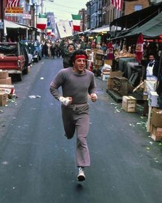 a man running down the middle of a street