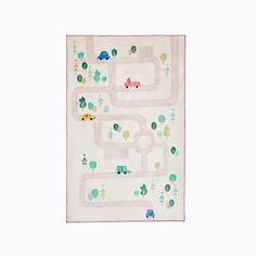 a child's play mat with cars and trees on the road in pastel colors