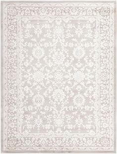 a white rug with an intricate design on the front and back side, in shades of gray