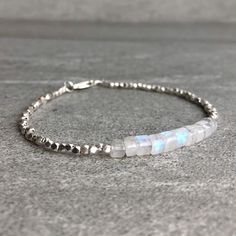 Rainbow Moonstone Bracelet | Natural Crystal Jewelry | Hill Tribe Silver Tiny Bead Bracelet | Dainty Genuine Moonstone Jewelry by GemsByKelley on Etsy https://www.etsy.com/listing/596364500/rainbow-moonstone-bracelet-natural Moonstone Beaded Bracelets With Natural Stones, Silver Minimalist Beaded Bracelets With Natural Stones, Minimalist Moonstone Bracelets With Round Beads, Minimalist Moonstone Bracelets With Natural Stones, Minimalist Moonstone Bracelet With Round Beads, Hand-strung Silver Moonstone Beaded Bracelets, Silver Beaded Bracelets With Moonstone And Natural Stones, Silver Moonstone Beaded Bracelets With Natural Stones, Silver Beaded Bracelets With Natural Moonstone