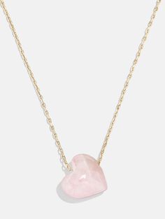 Opt for a little self love in your stack when you choose the Juno Necklace. This piece features a dainty gold chain complete with a heart-shaped rose quartz pendant. Rose quartz represents and helps manifest self love, compassion, and romance, so this piece is sure to add good vibes to your necklace collection. Rose Necklaces For Valentine's Day, Chic Adjustable Heart-shaped Necklace, Chic Heart-shaped Adjustable Necklace, Chic Adjustable Jewelry For Valentine's Day, Feminine Rose Jewelry For Gifts, Feminine Rose Jewelry For Valentine's Day, Delicate Gemstone Necklace For Valentine's Day, Dainty Rose Jewelry For Valentine's Day, Elegant Rose Heart Necklace